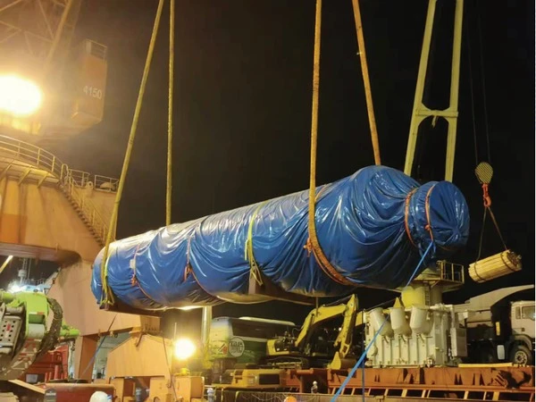 Wrapped cylindrical industrial equipment during heavy-lift cargo handling